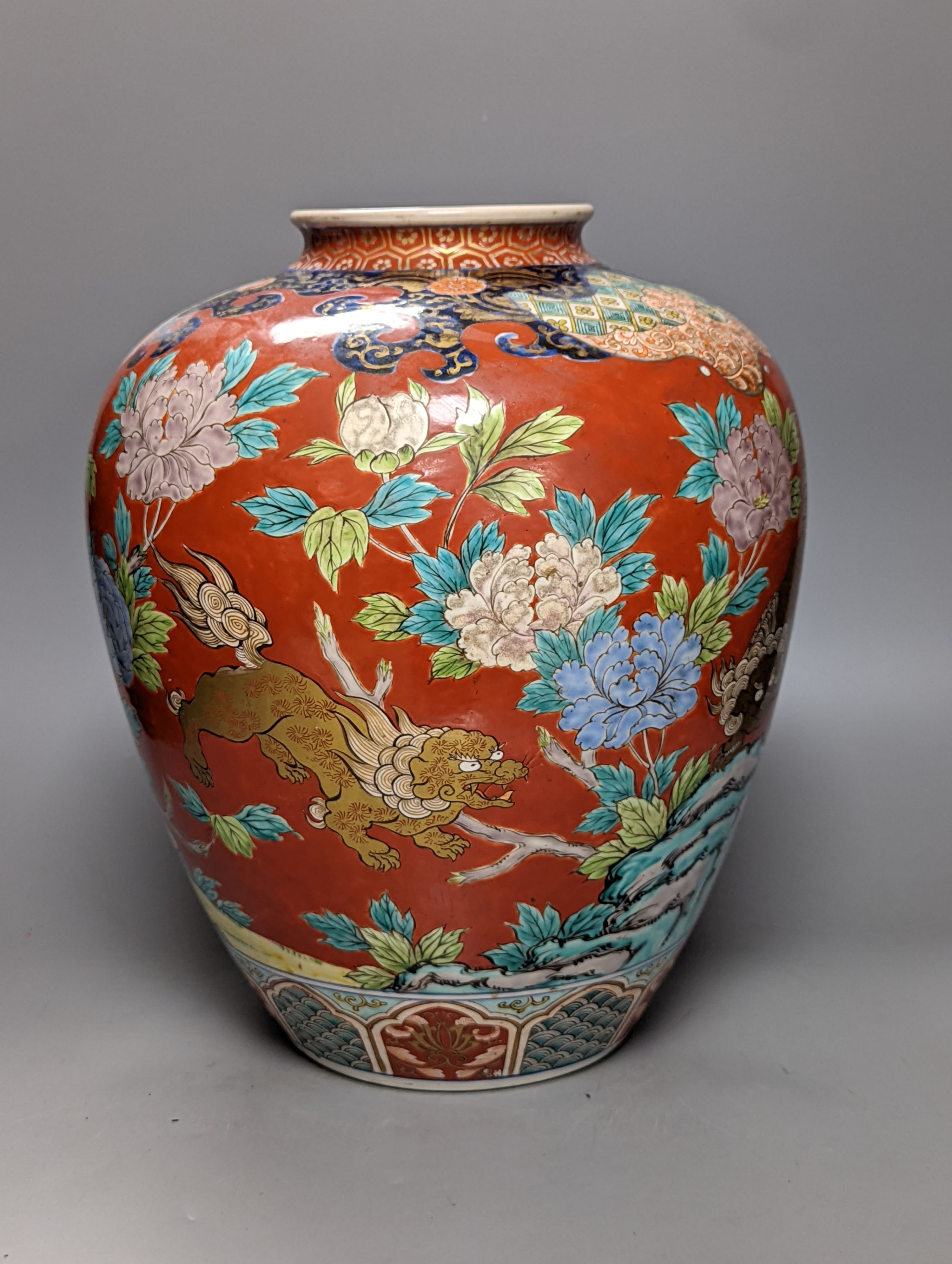 A large Japanese Kutani ovoid vase, painted with Buddhist Lions 36cm
